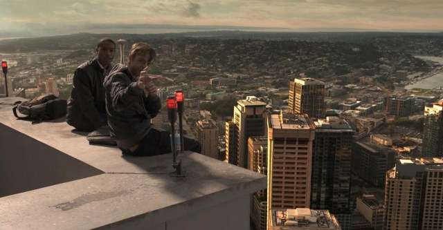 RF_056_001_V015.0486 - Steve (Michael B. Jordan, left) and Andrew (Dane DeHaan) sit atop a Seattle skyscraper. (They did not get there via elevator…)